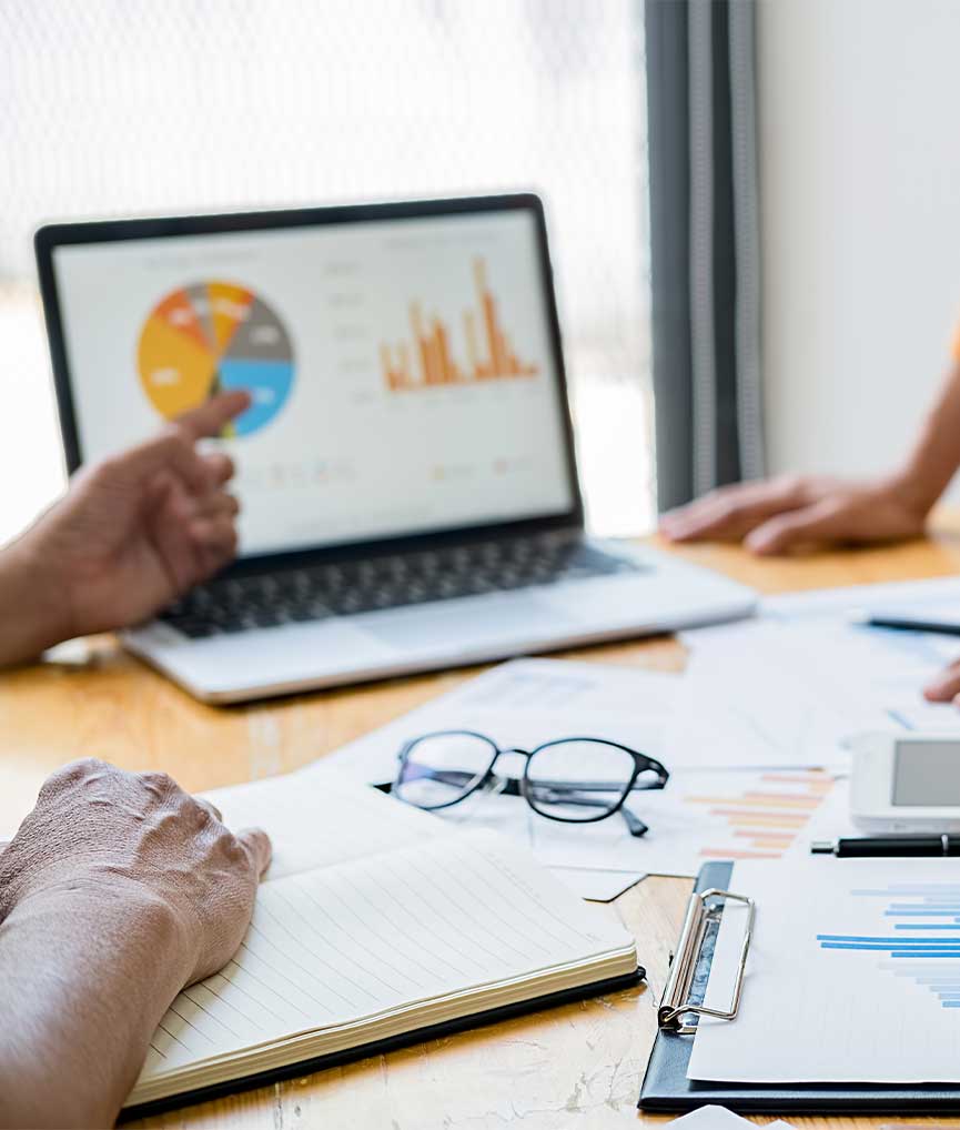 Pointing at data on laptop