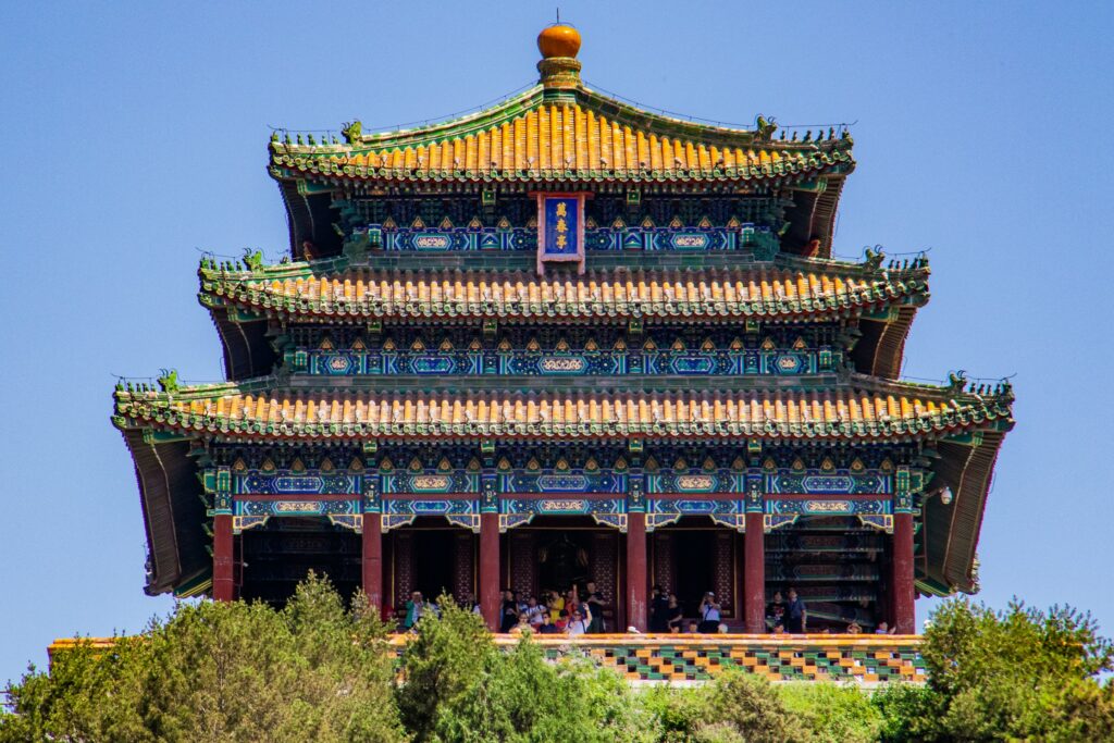 A photograph of a Chinese pagoda temple with pillars at the front